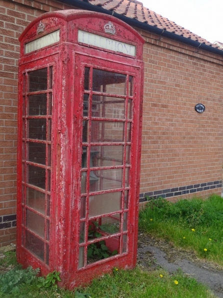 Red telephone box at Muston